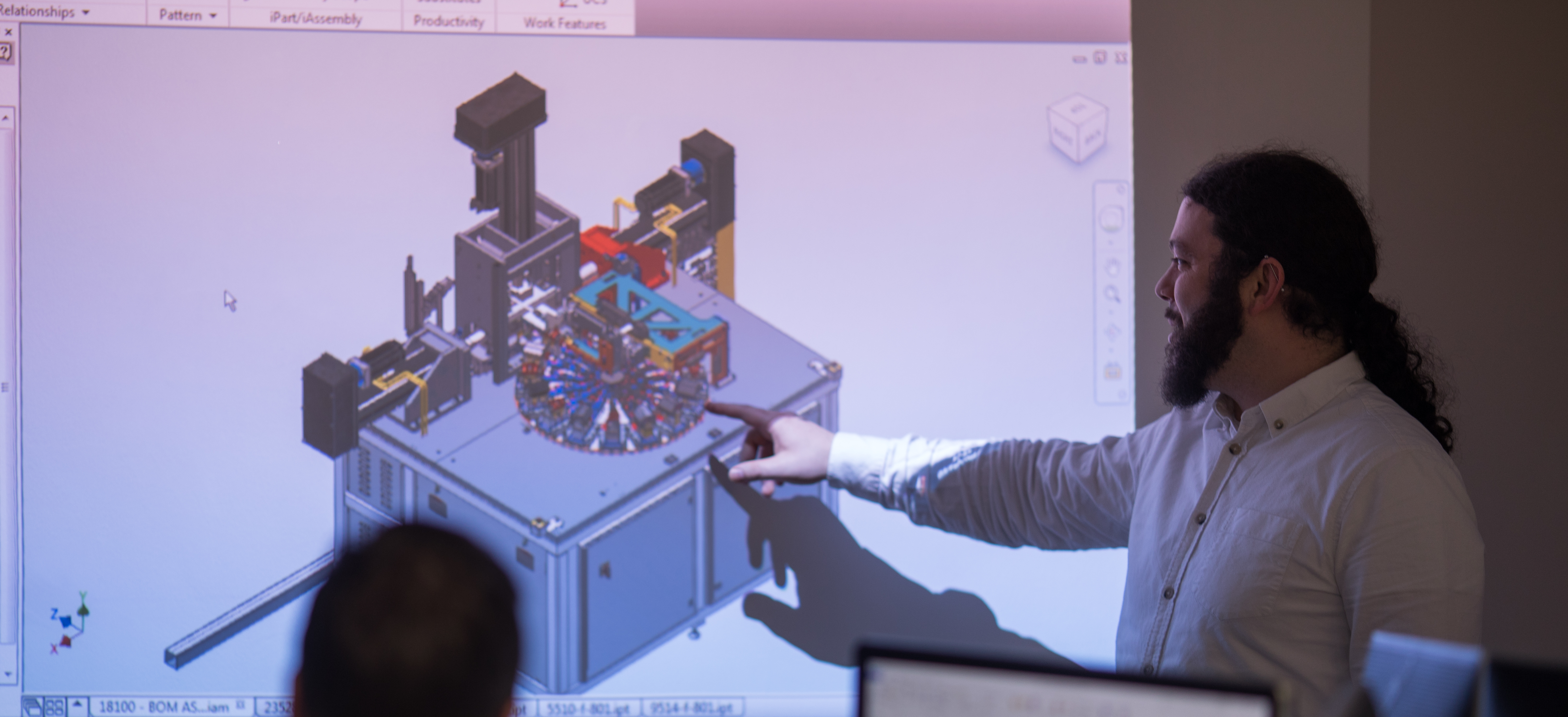 engineer explaining the specifications of project to team using presentation