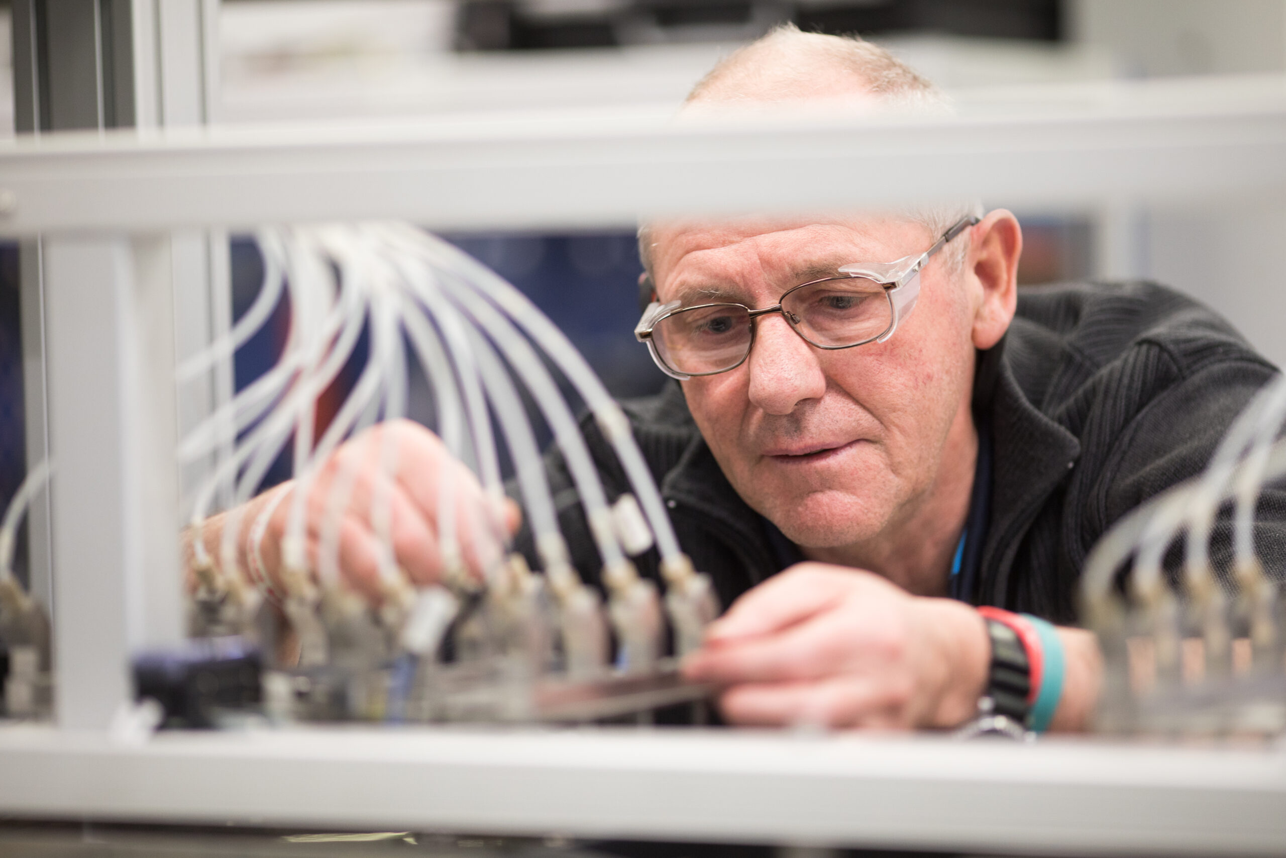 engineer reviewing cable connections