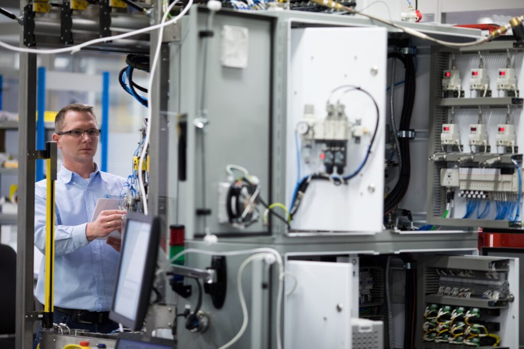 engineer reviewing machine configurations of build to print project